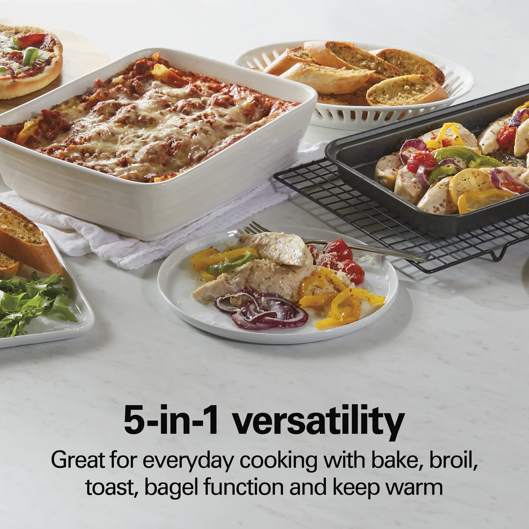 Hamilton Beach 4-Slice Countertop Toaster Oven with Bake Pan, Broil & Bagel Functions, Auto Shutoff, Stainless Steel (31143)