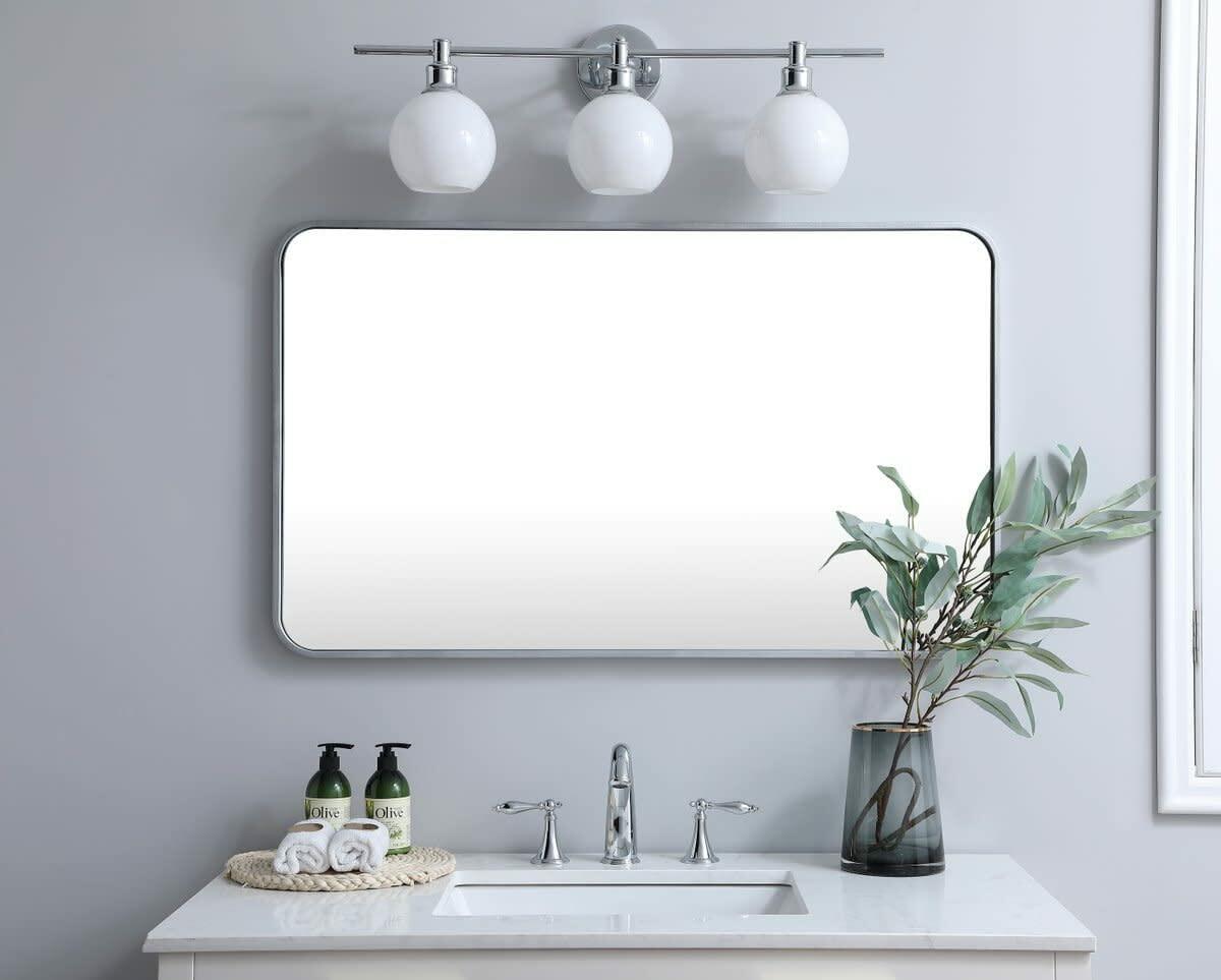 Elegant Decor Evermore 24x40 Soft Corner Metal Rectangular Mirror in Brass